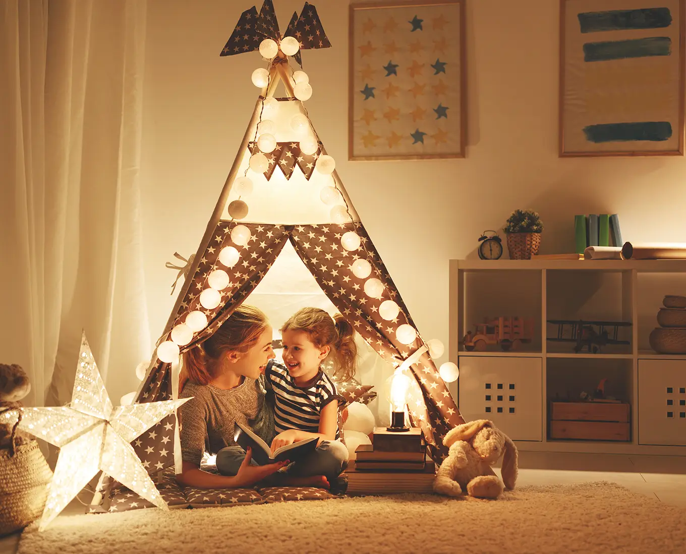 Warmly lit children’s teepee with glowing string lights and soft ambient lighting, illustrating safe and reliable residential electrical services in O'Fallon IL